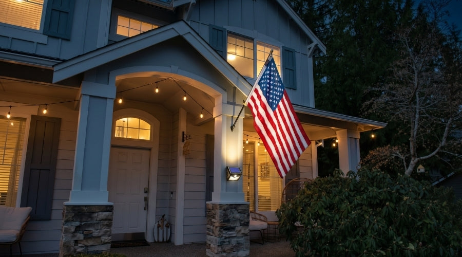 Elizabeth Ross American flag at night, lit up by a solar powered flag light.